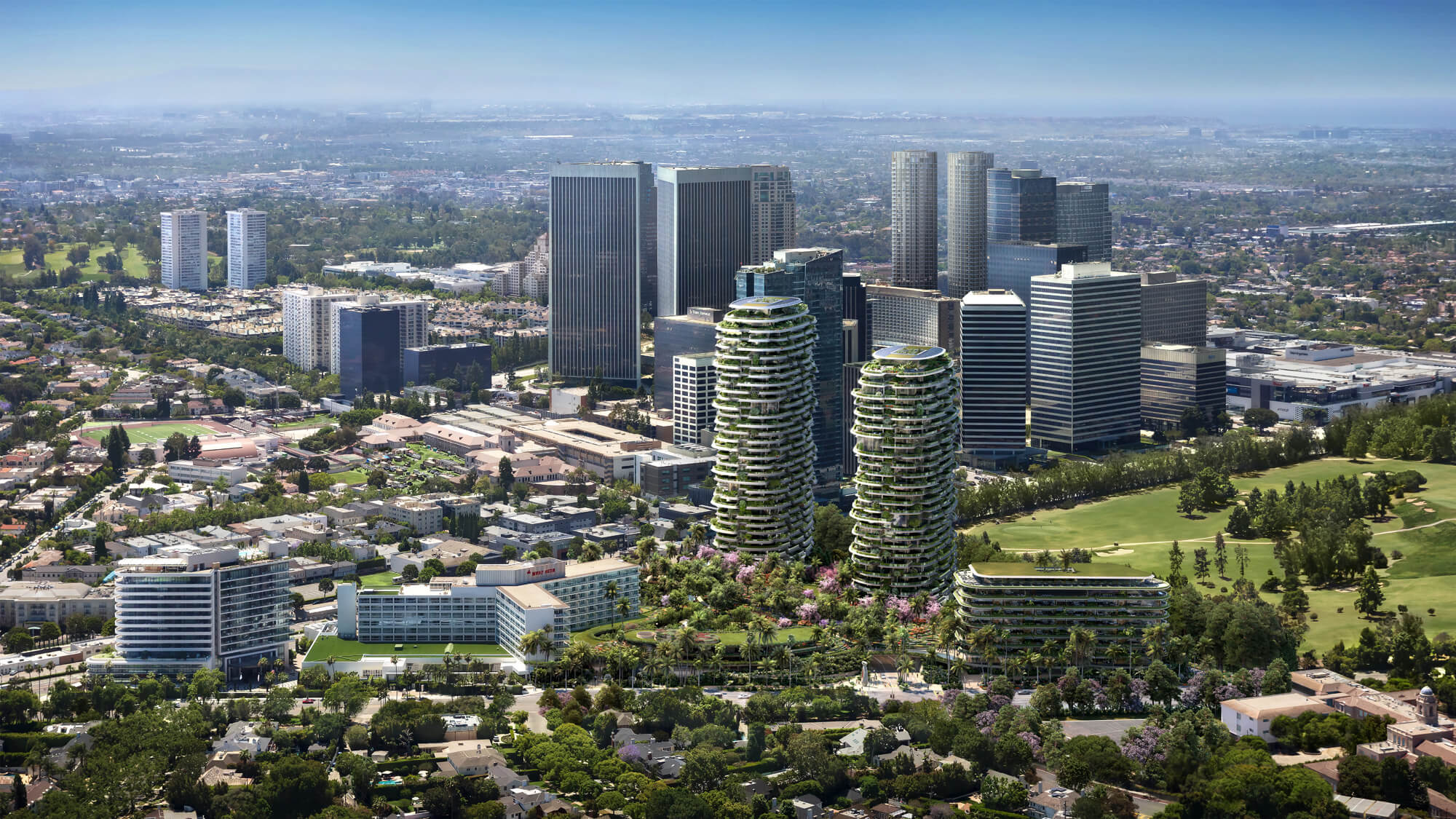 aerial view of development with two plant-clad towers