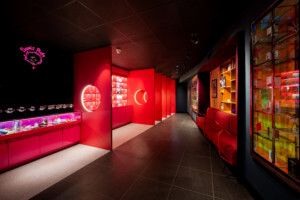 Inside of a cannabis store in all red decor