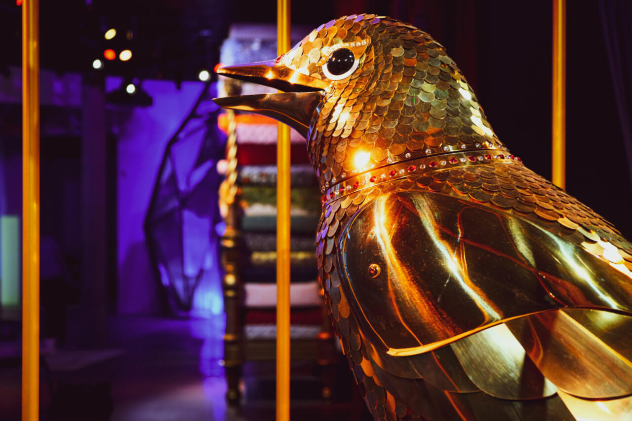 close up of a gilded bird statue