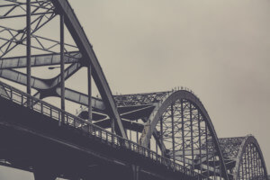 black and white photo of bridge trusses
