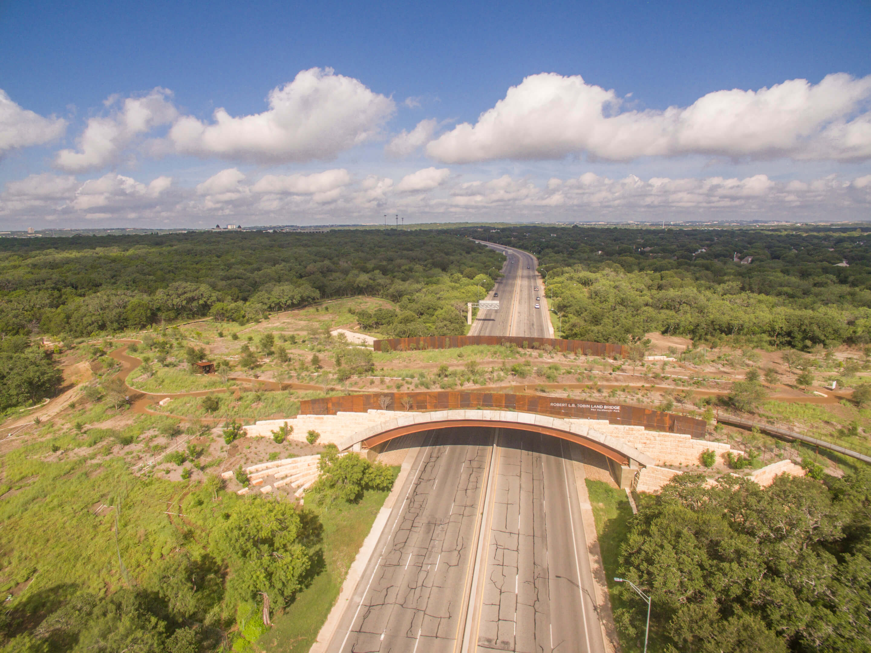 Aerial photograph of a land bridge spanning a highway in san antonio