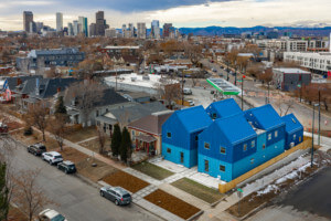 aerial view of suburbs in Denver with blue building in foreground