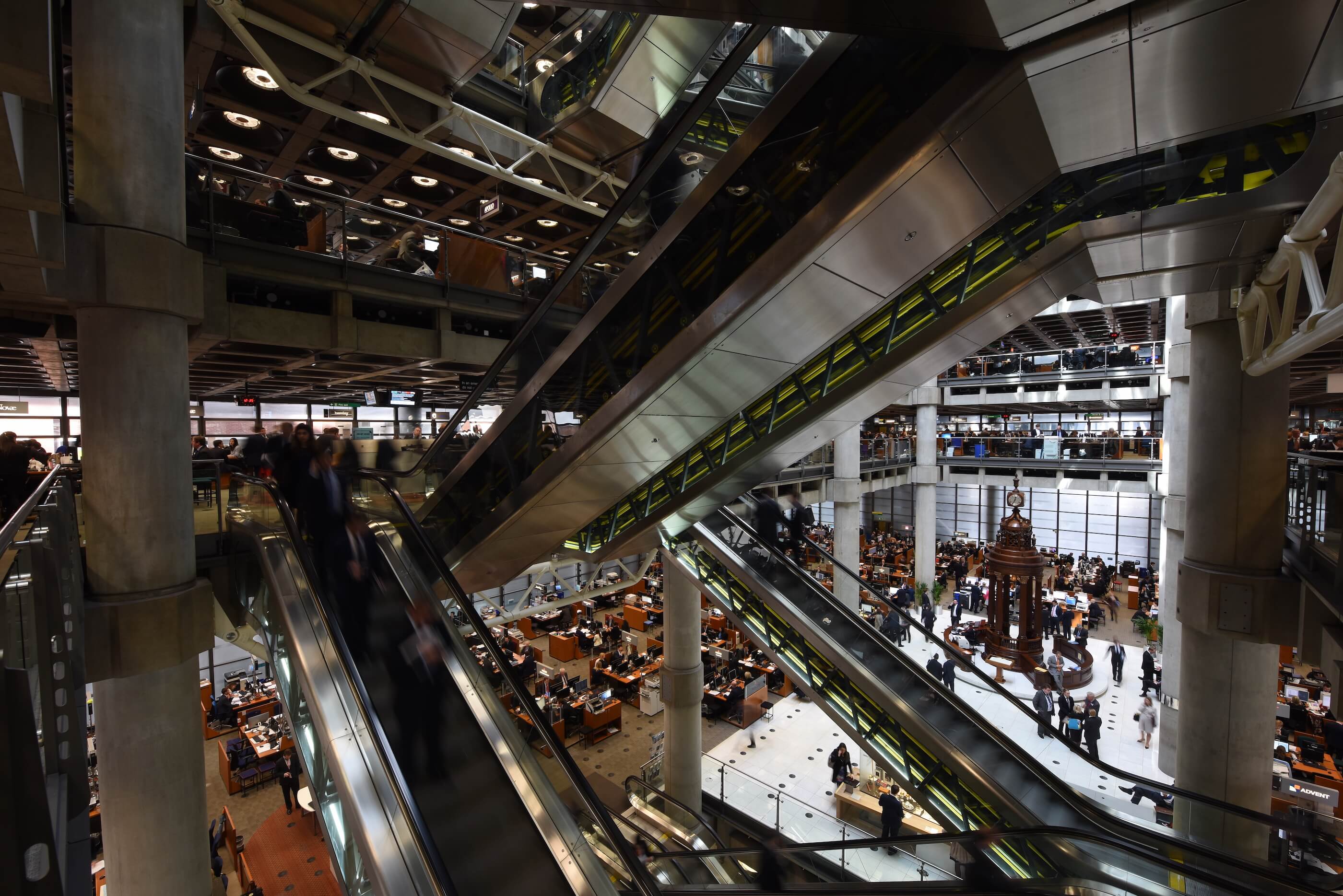 Interior of a massive atrium space with sprawling escalators in every direction