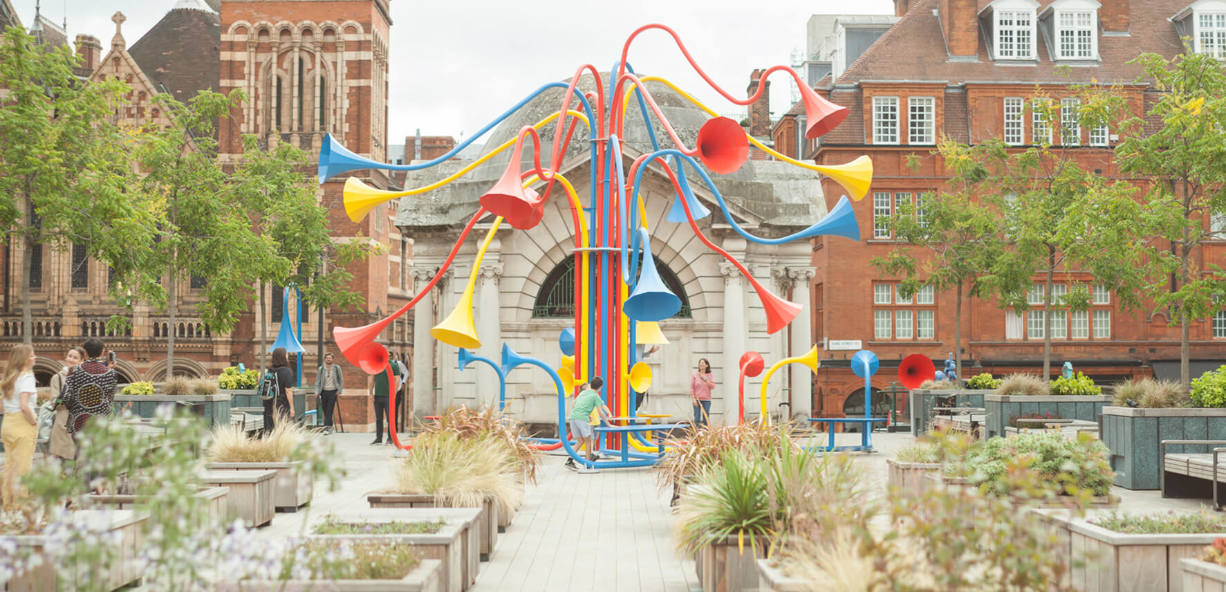 a colorful, sculptural sound installation in a park