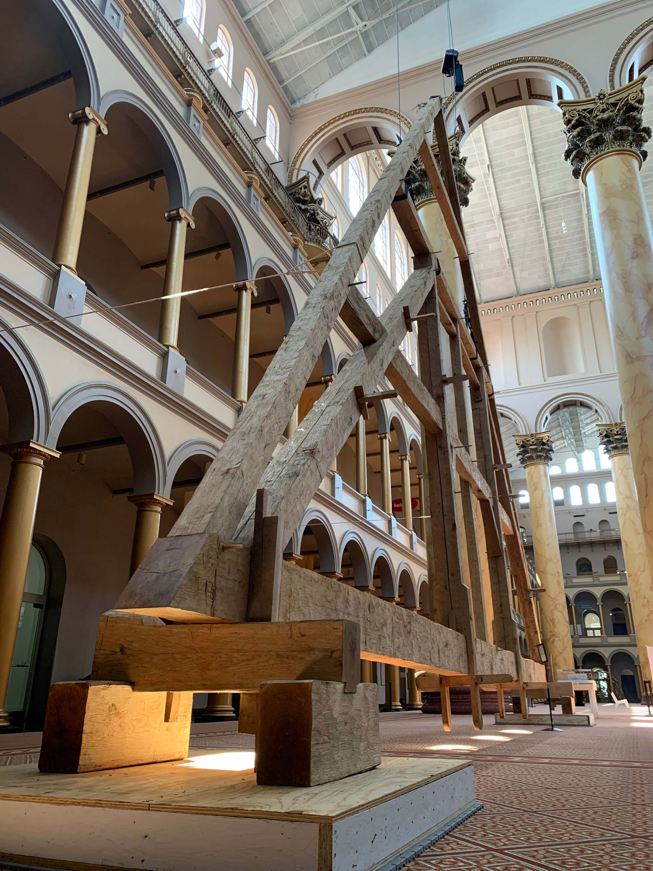 truss on display in the great hall of a museum