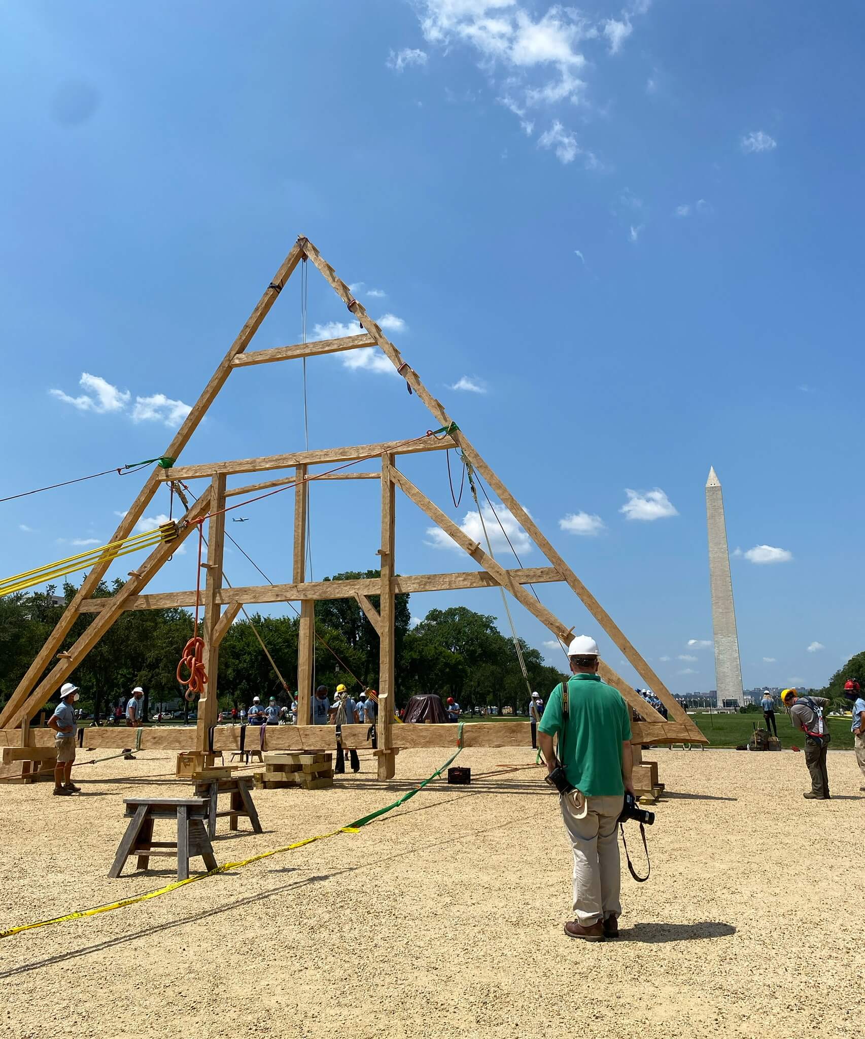 a wooden truss on display in front of the washington memorial