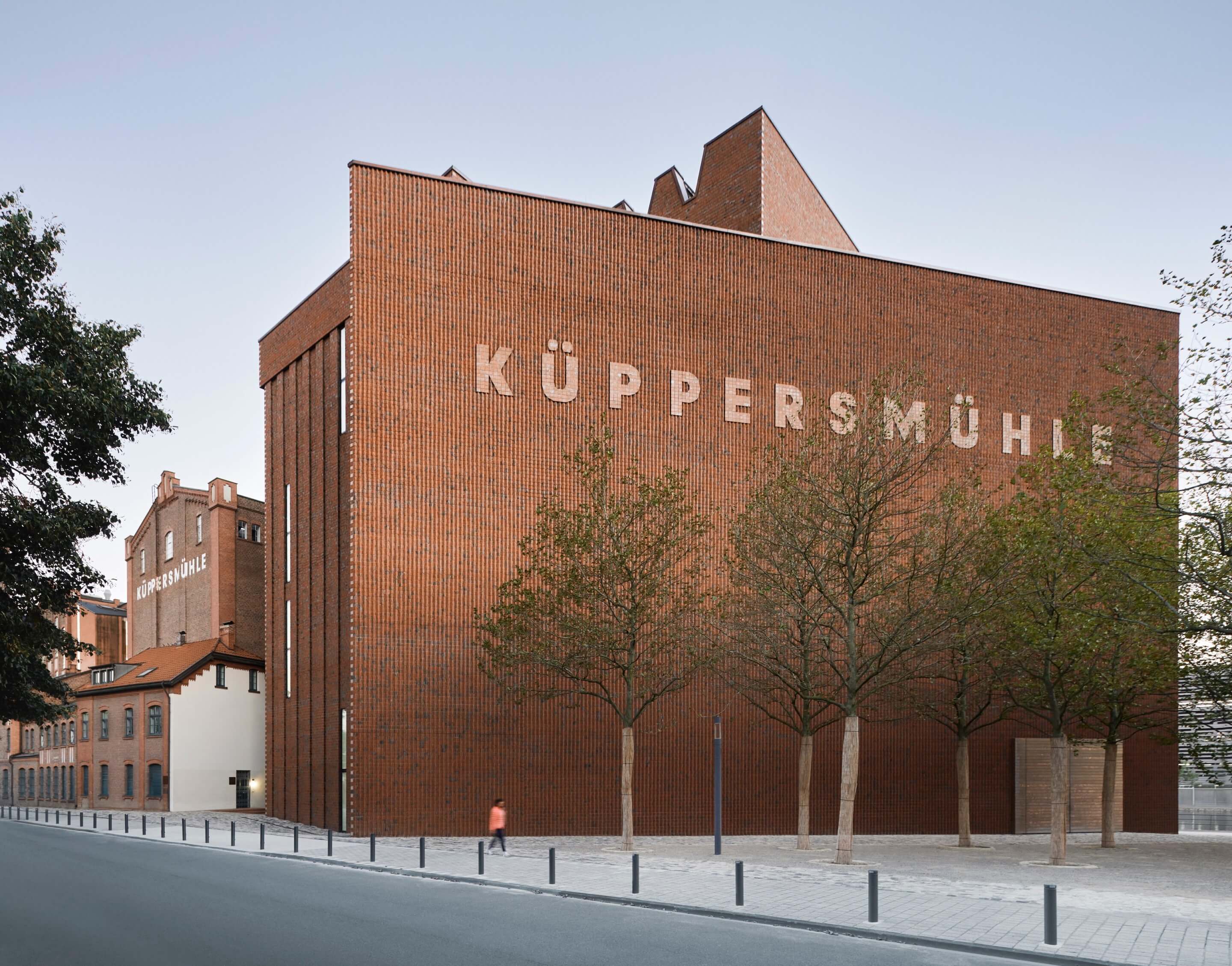 exterior of a red brick museum building with signage at the mkm