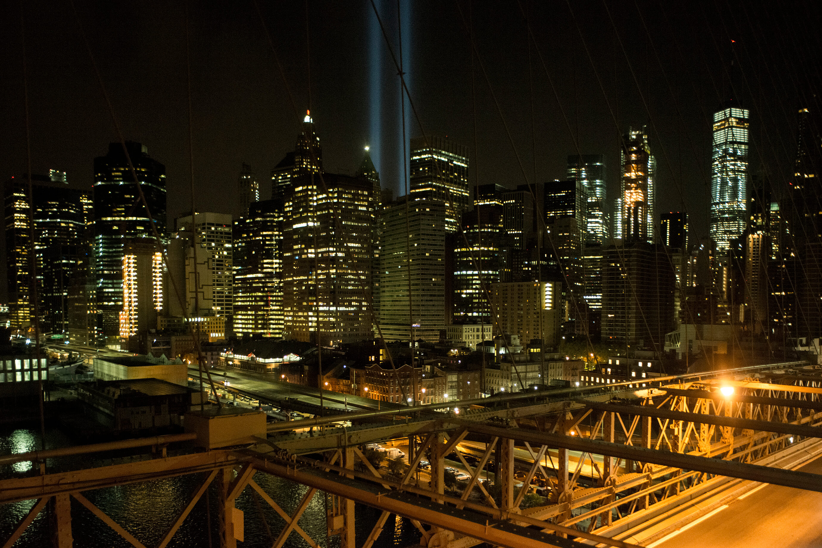 Twin towers of light above the manhattan skyline