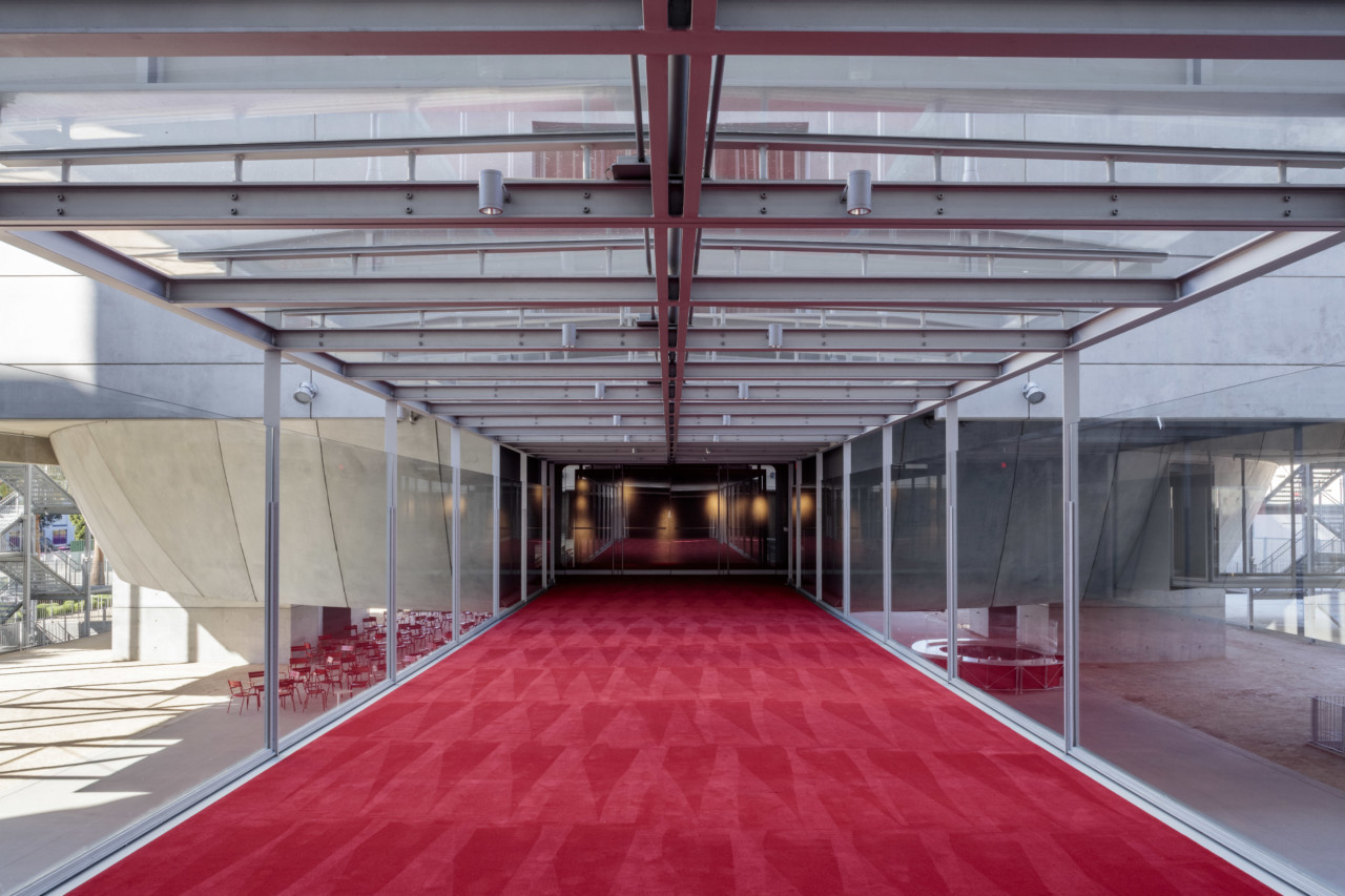 photograph of red carpet leading into a theater
