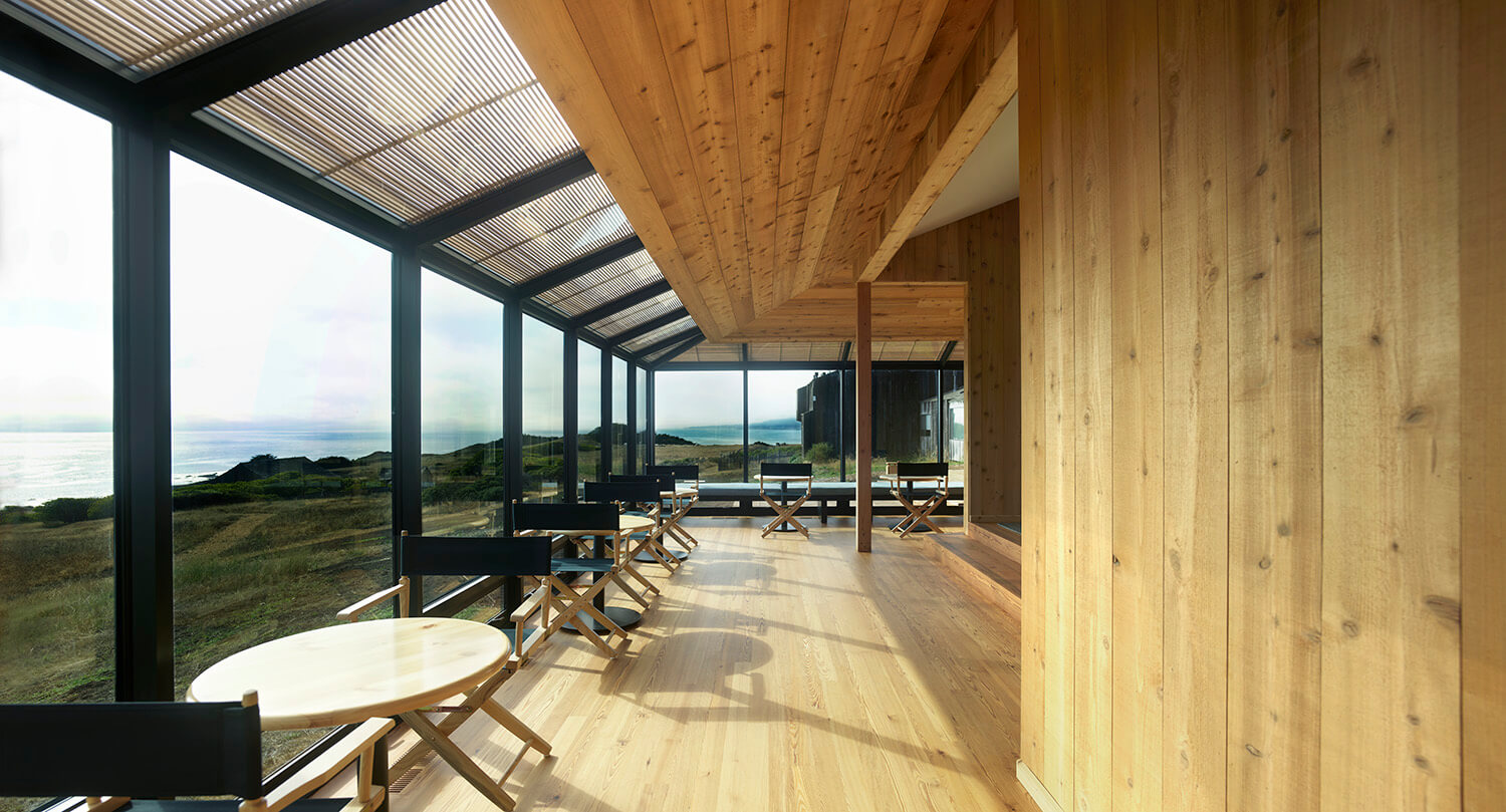 Interior of wooden building with view of ocean at sea ranch