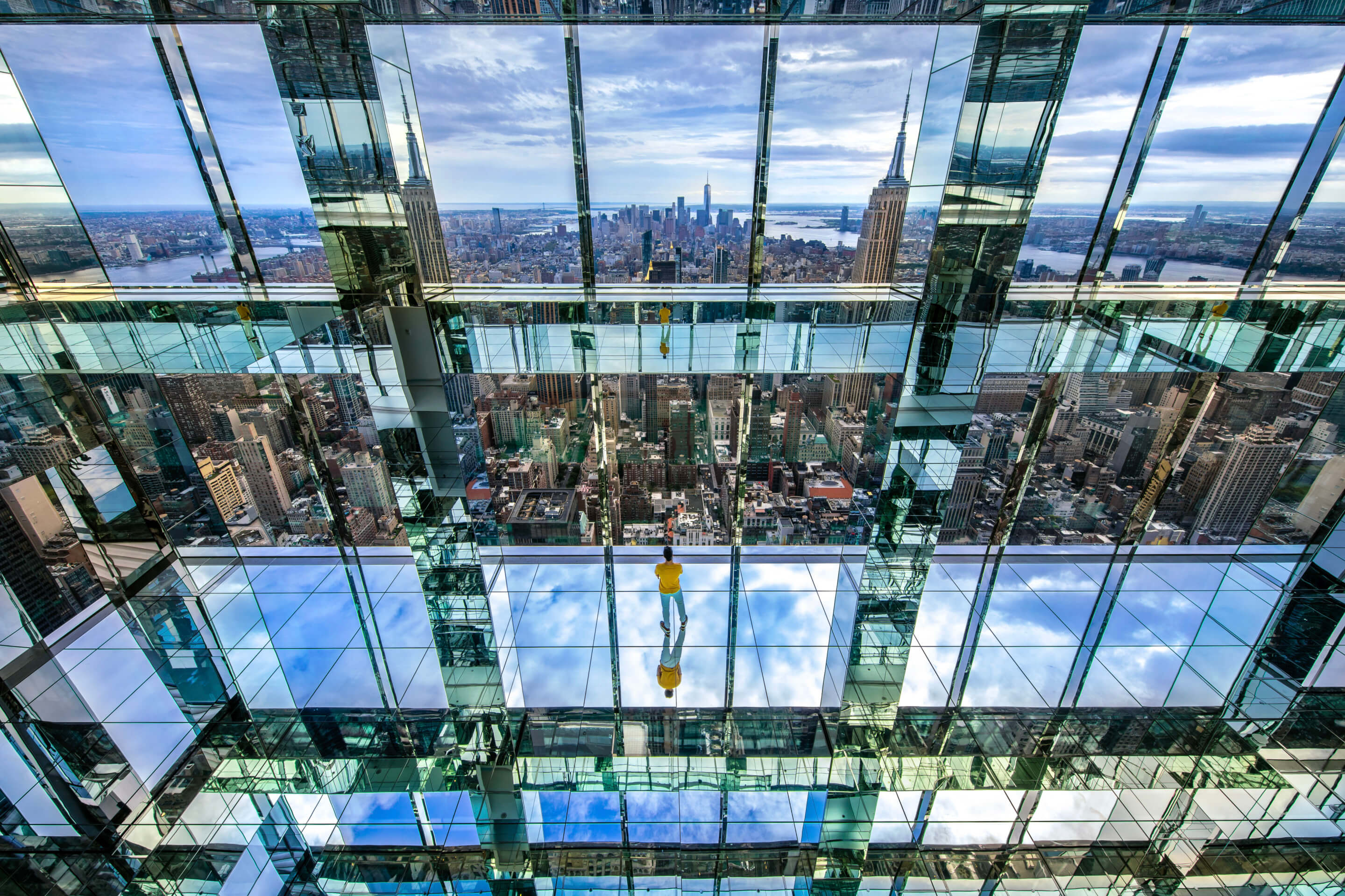 a mirrored observation area looking out into manhattan