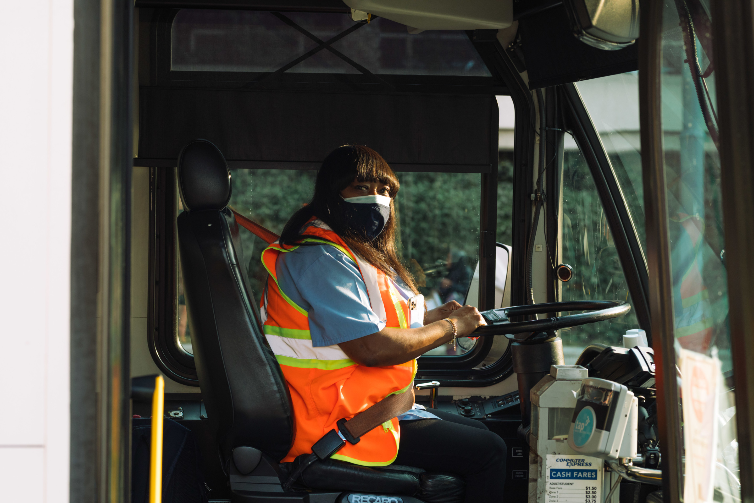 A los angeles bus driver with a high vis vest