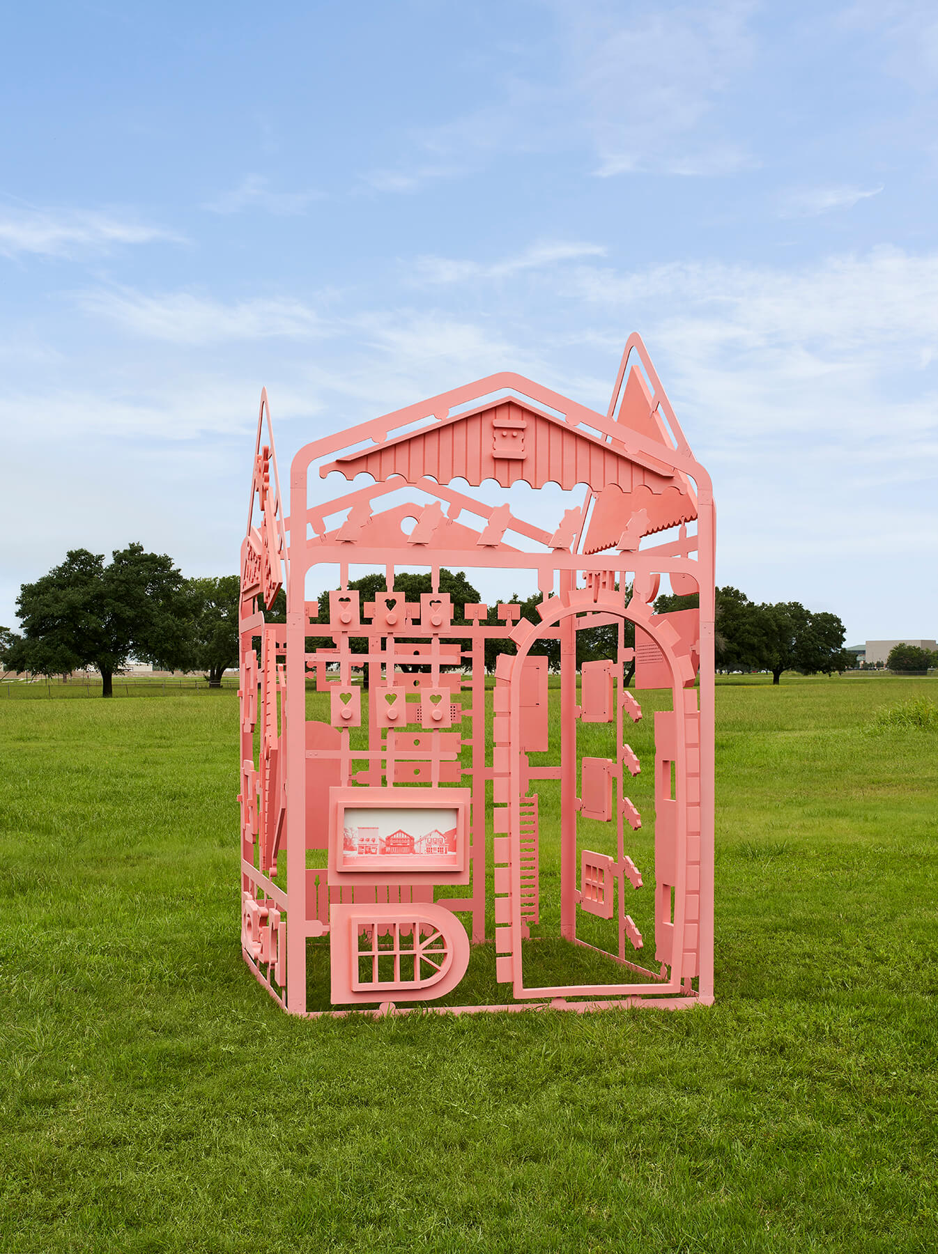 a color-coated installation, fabricating swissness, in a field of grass