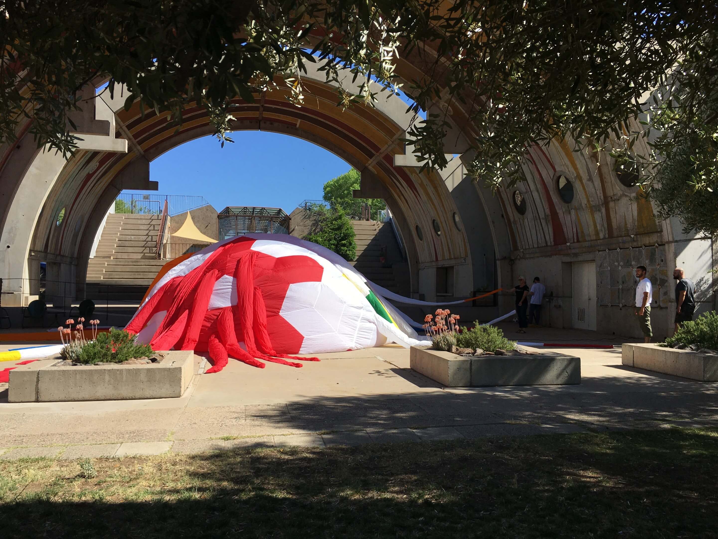 An inflateable shelter inside of an arched dome
