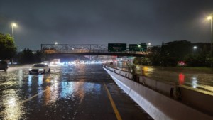a flooded freeway in new york left submerged by hurricane ida, emblematic of the climate crisis