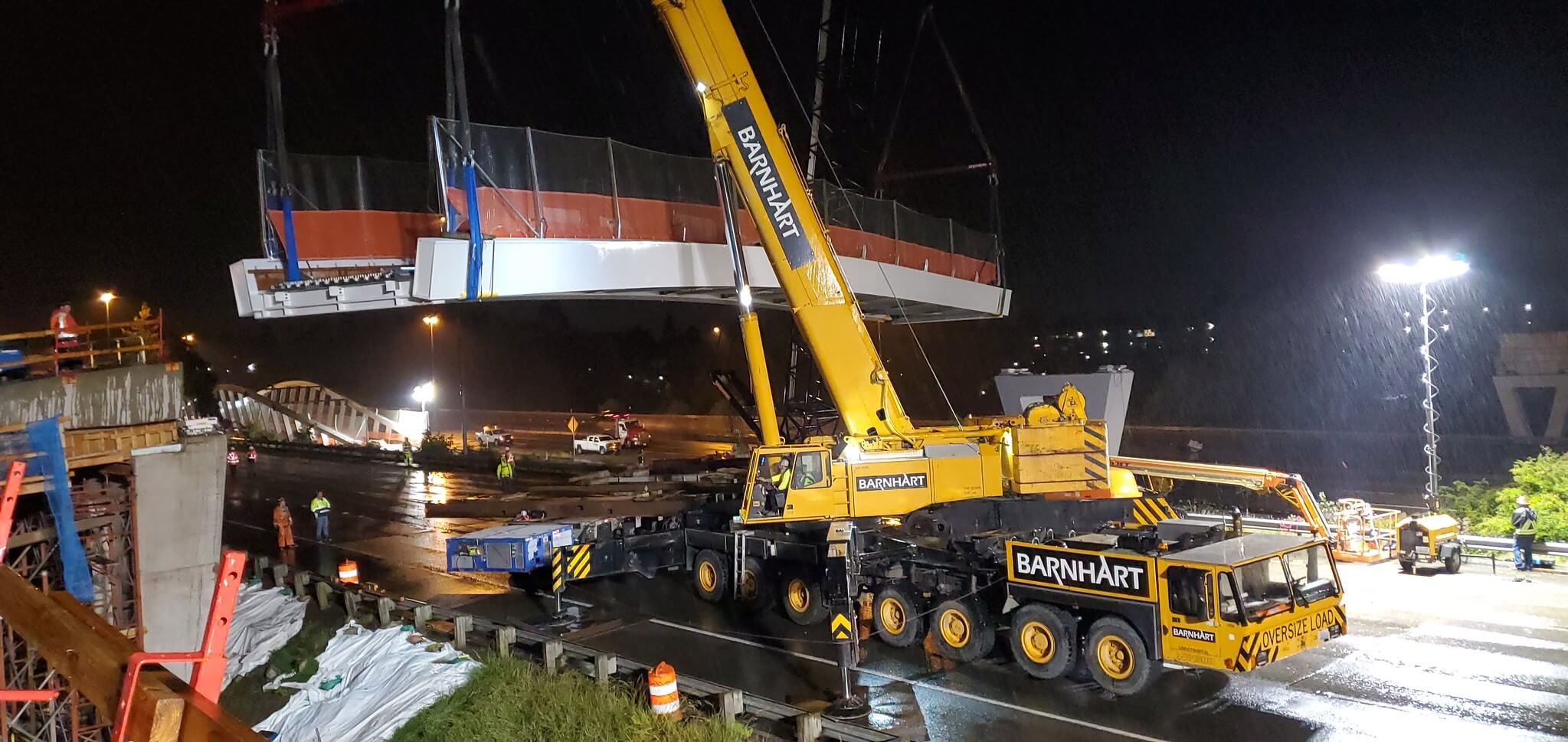 a bridge segment being lifted into place