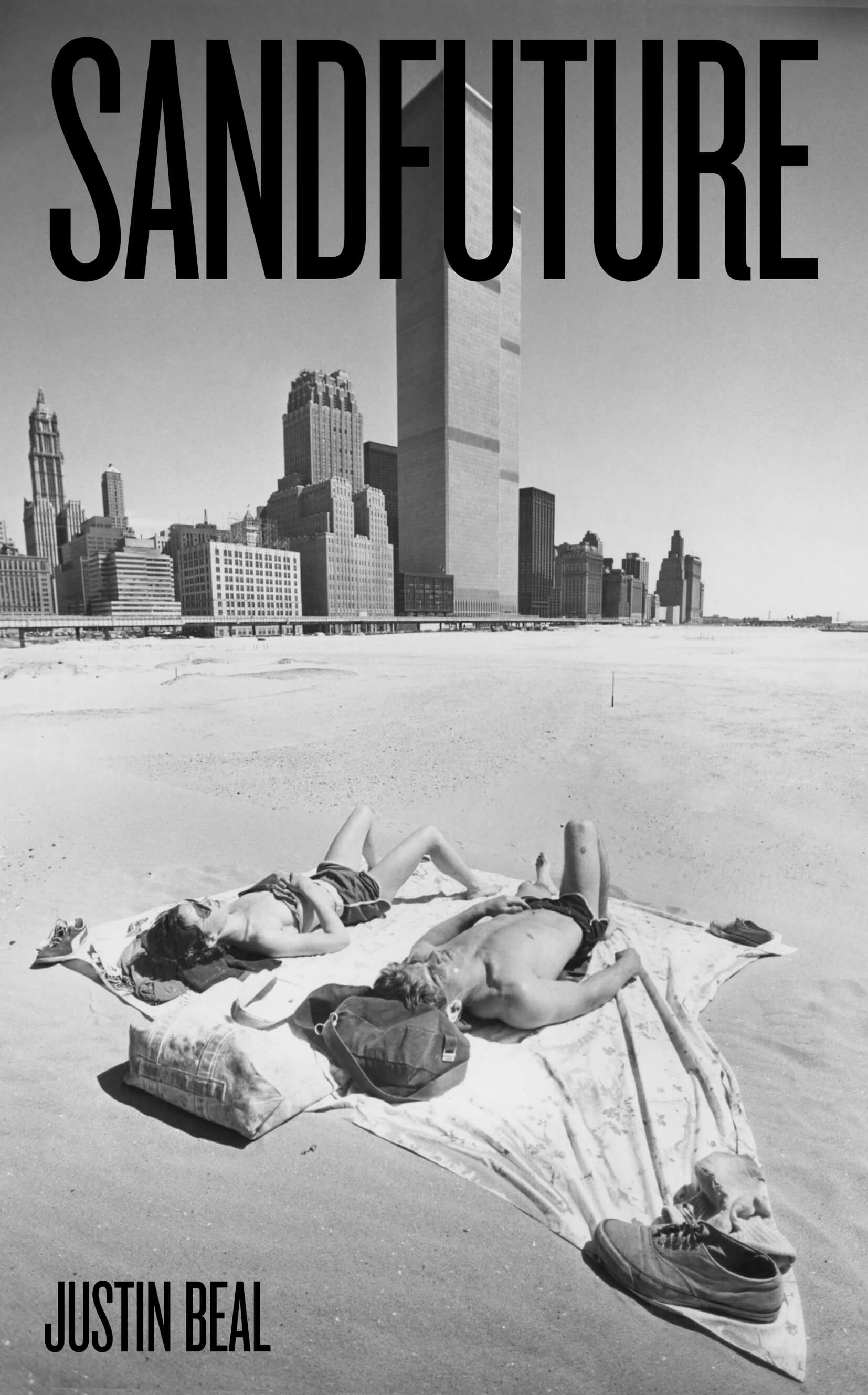 a couple relaxing on the beach in front of the world trade center
