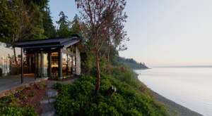a home perched on a cliff above the puget sound
