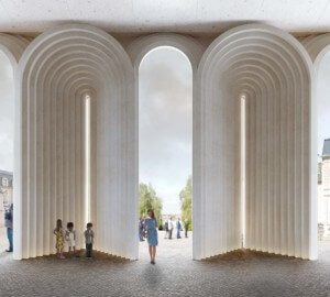 White stone arches leading out from a church, designed by kengo kuma