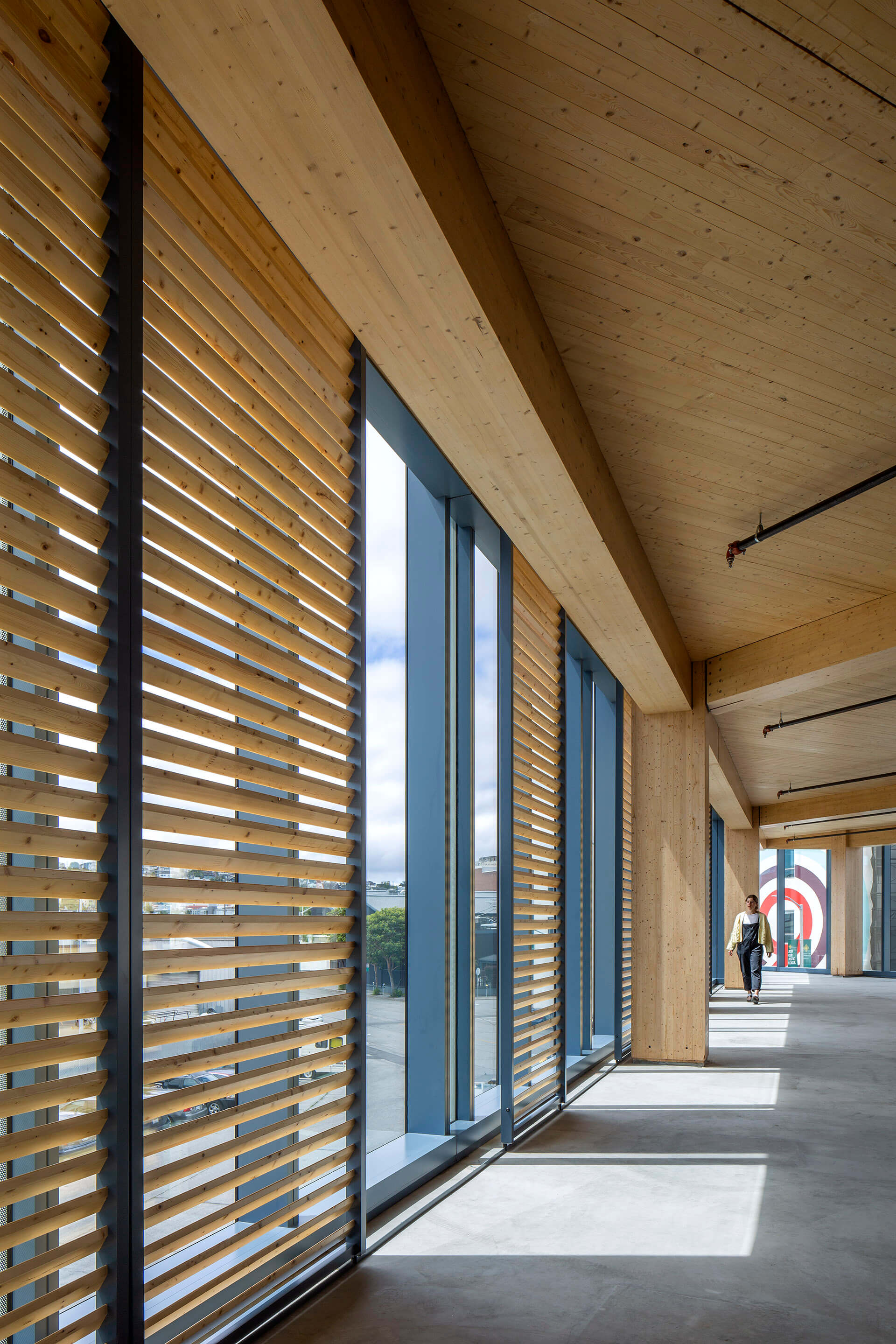 interior of a mass timber building with sunshades