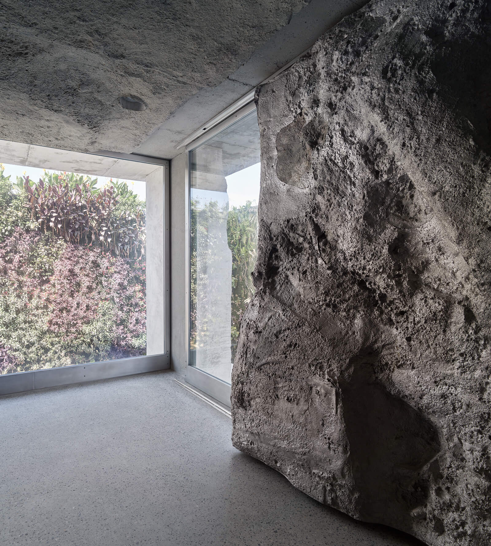 Interior photo of a sand-cast concrete wall