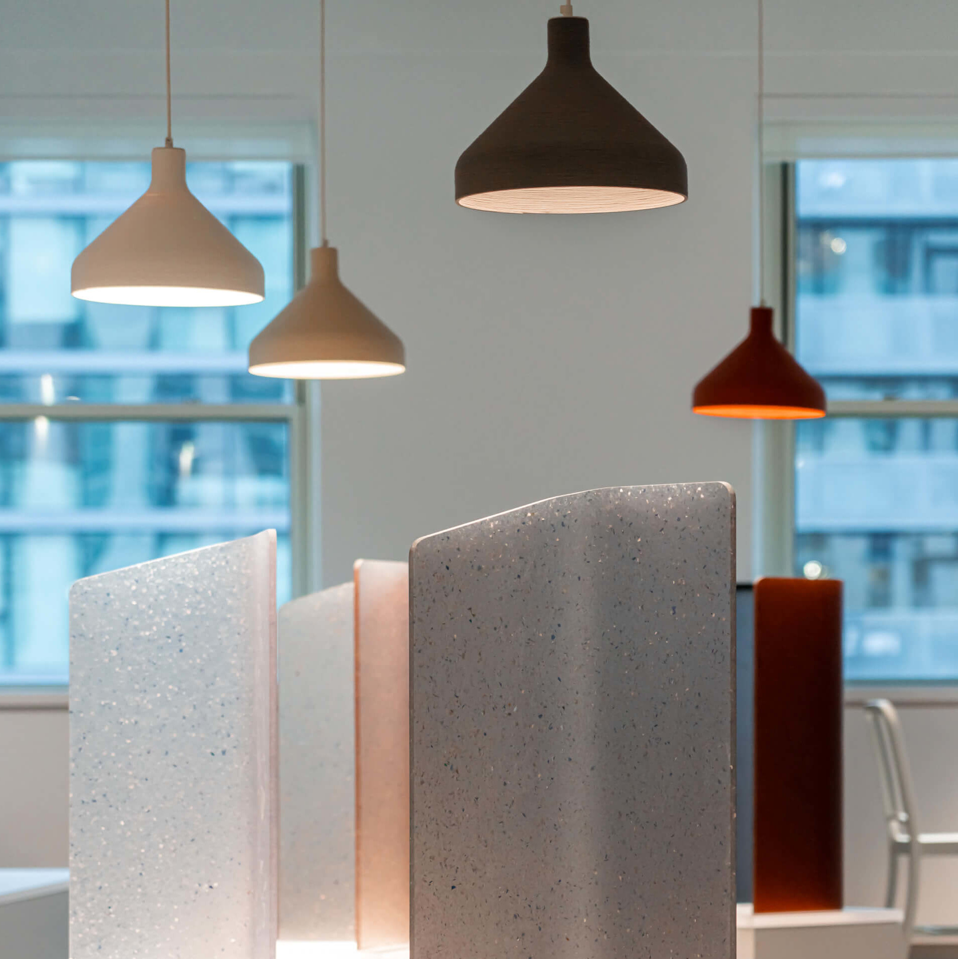 lamps and material samples within in a interior shown at neocon