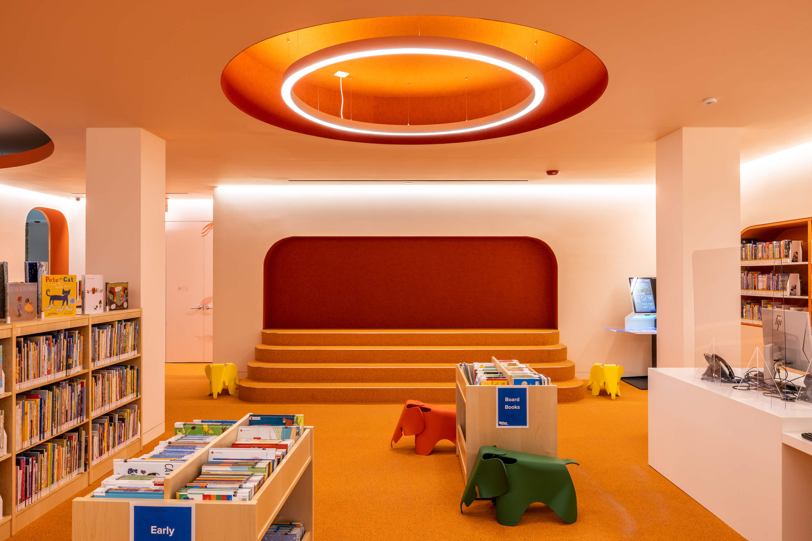 an orange-hued children's area in a public library 