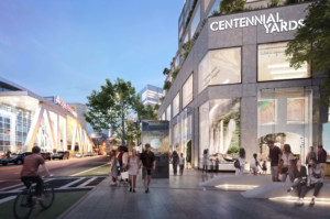rendering of people walking down a lively retail street in a redeveloped area in Centennial Yards