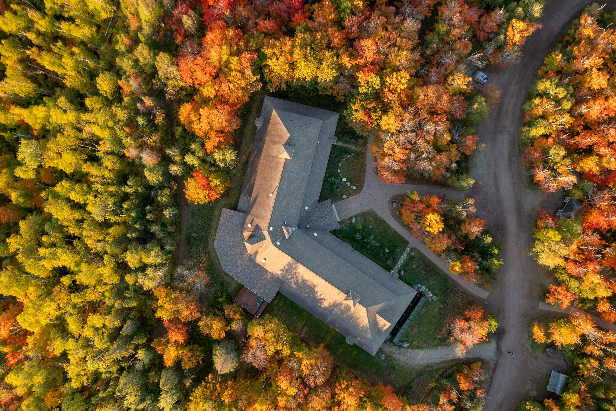aerial view of a lodge building surrounded by trees