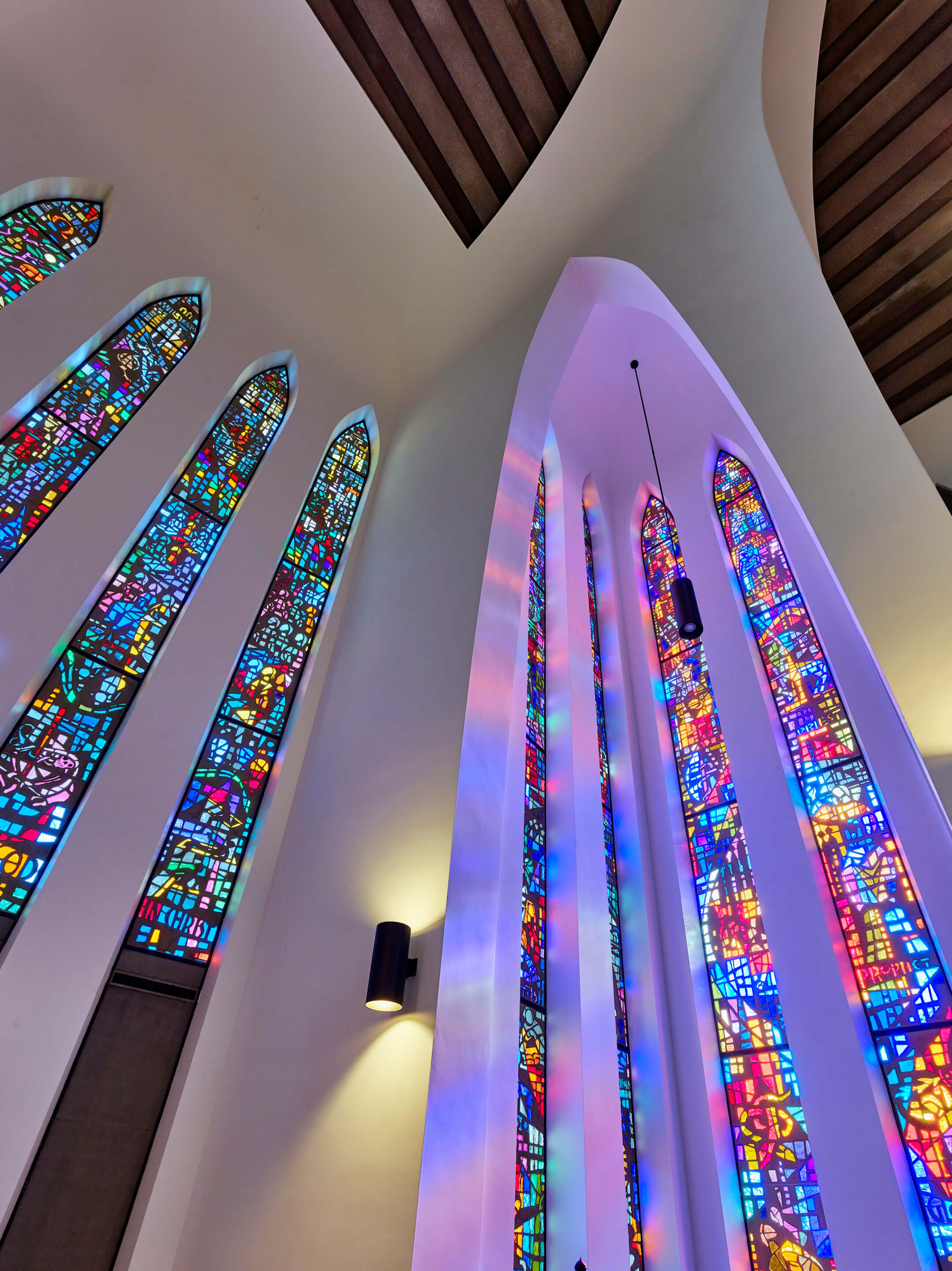 long vertical panes of stained glass in a modernist church