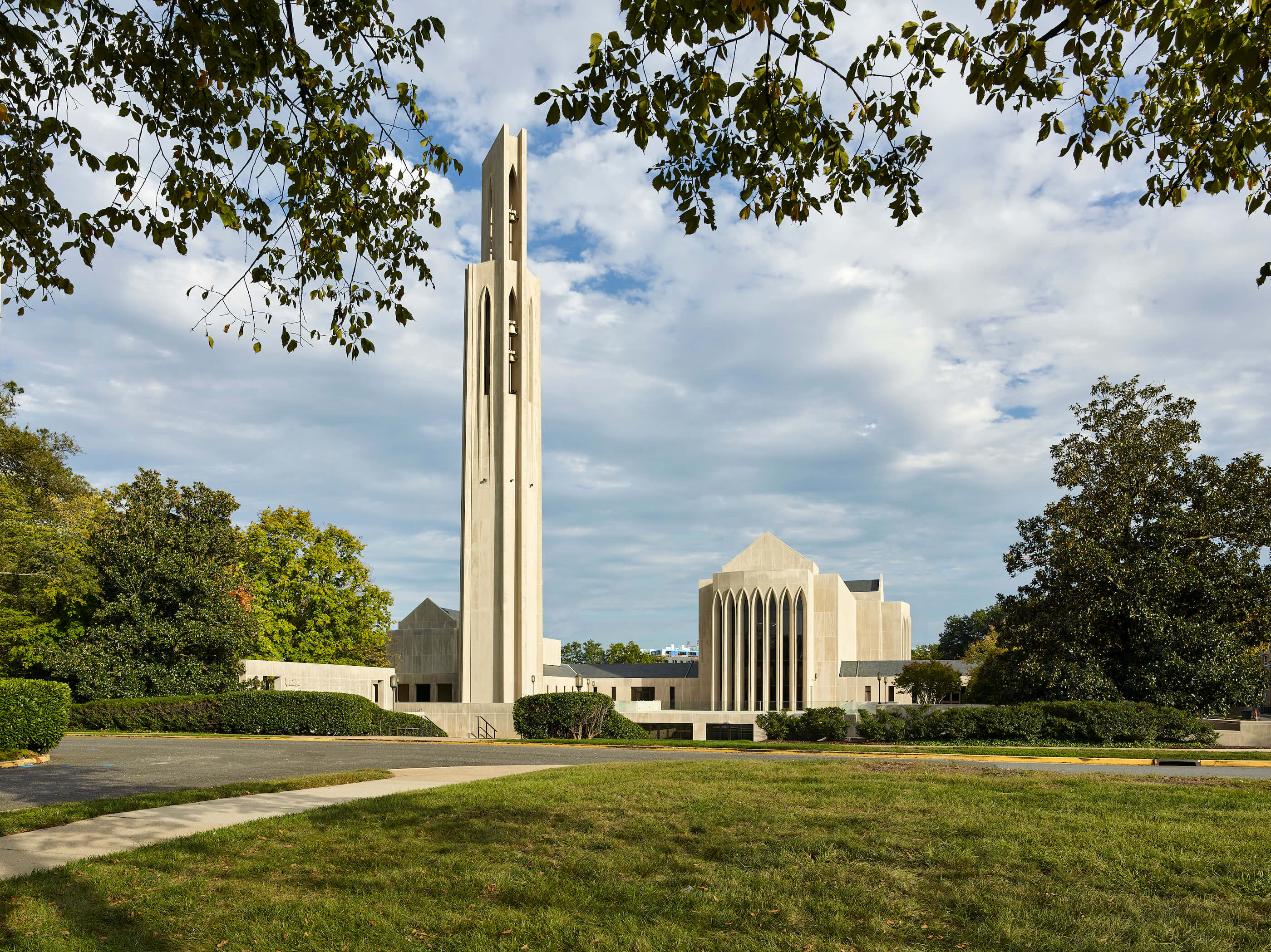 a modernist church campus with a tall bell tower