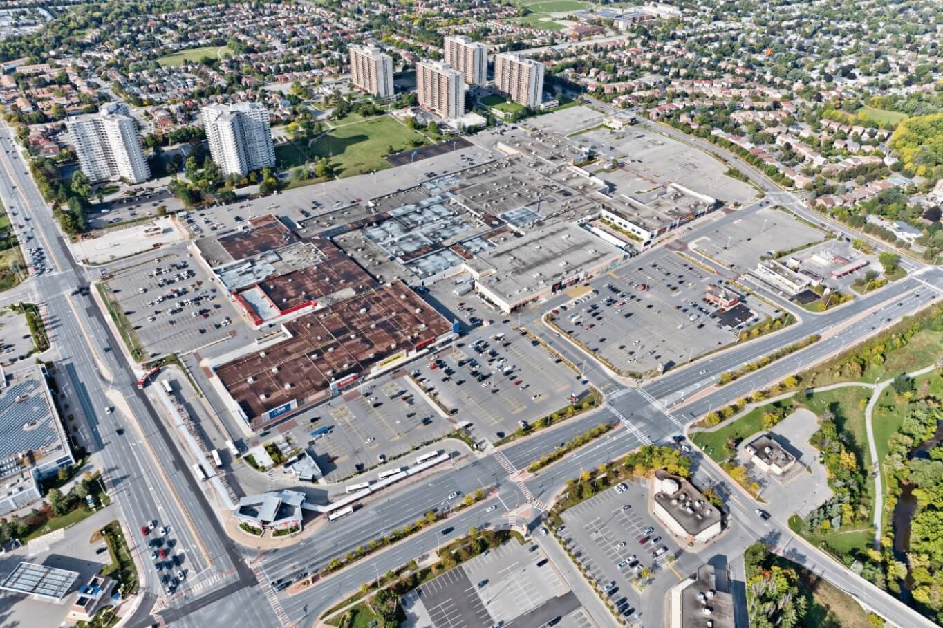 aerial photo of a mall and parking lots at the shoppers world brampton site