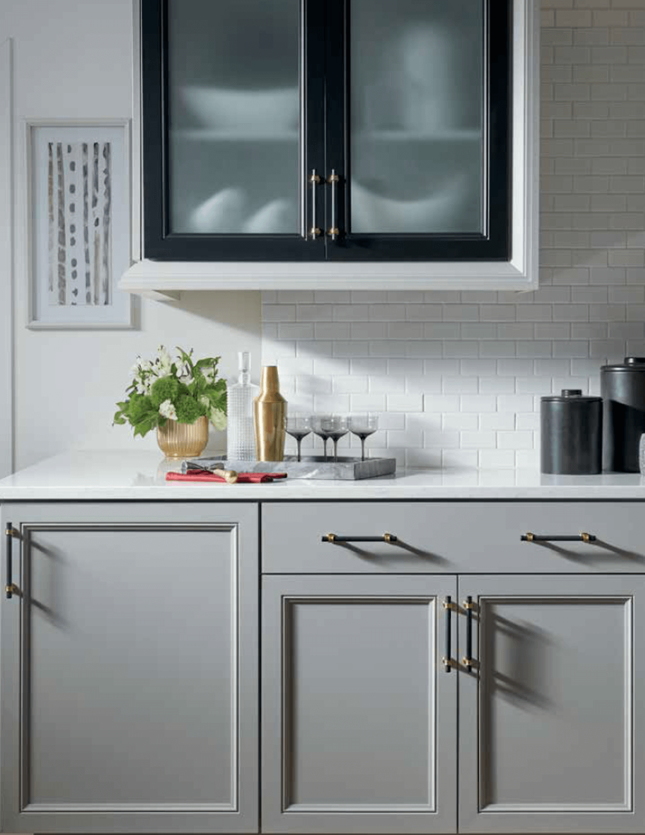 a kitchen counter and cabinets and grey color scheme