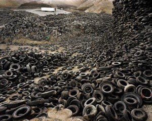 A big pile of tires on display for waste age