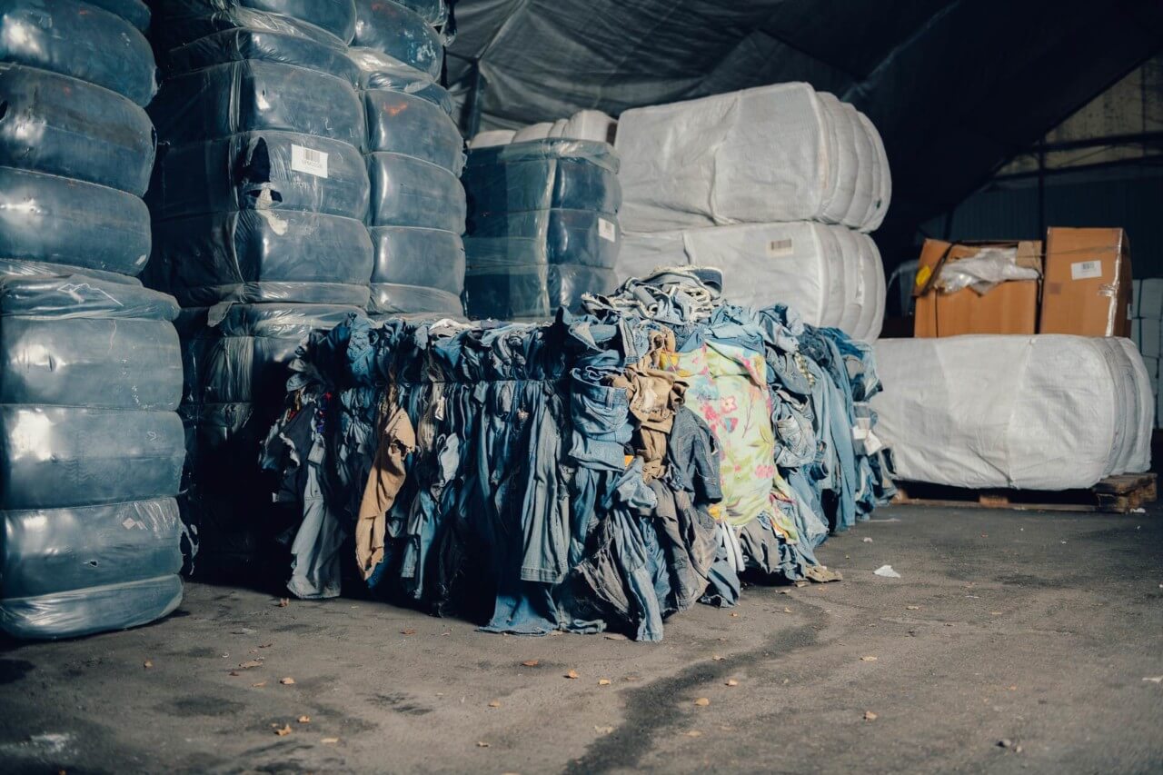 A pile of jeans in a dump