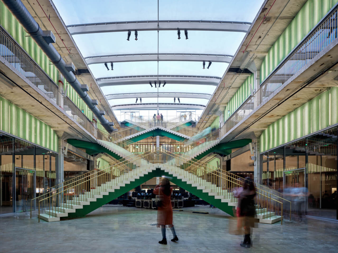 a massive criss-crossing staircase in a former industrial space