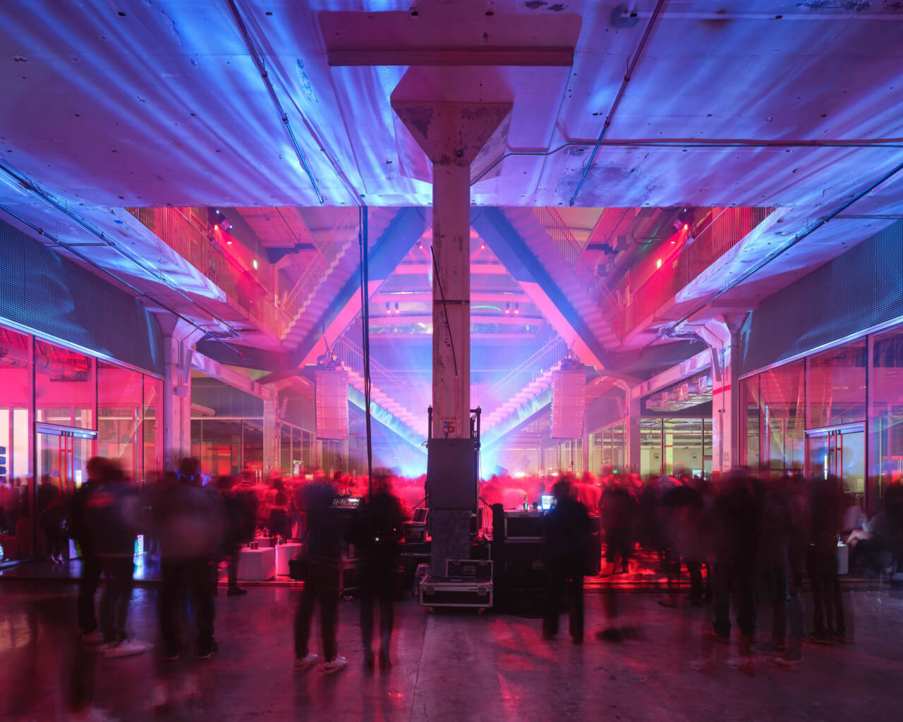 an event held in a soaring industrial space with moody lighting