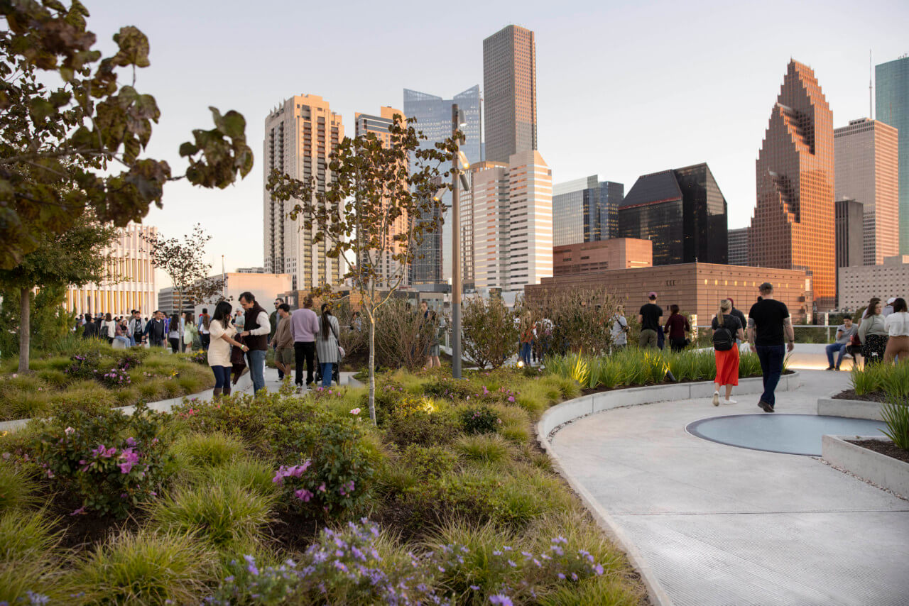a walking trail-laced rooftop park with clear views of the houston skyline