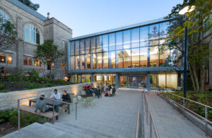 Swartz Hall, a collegiate gothic building with a new 2 story glass addition