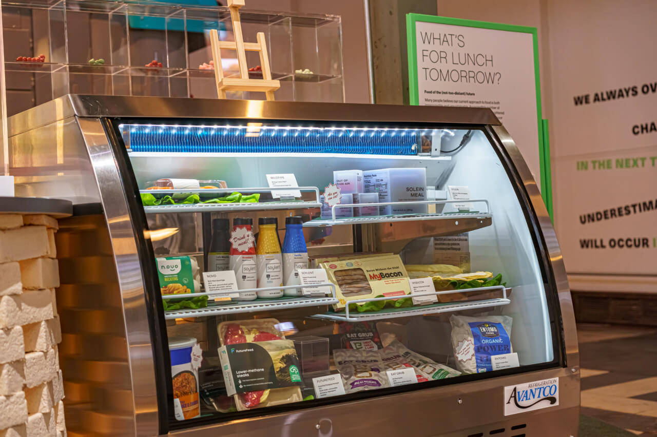 view of a deli case filled with plant-based proteins