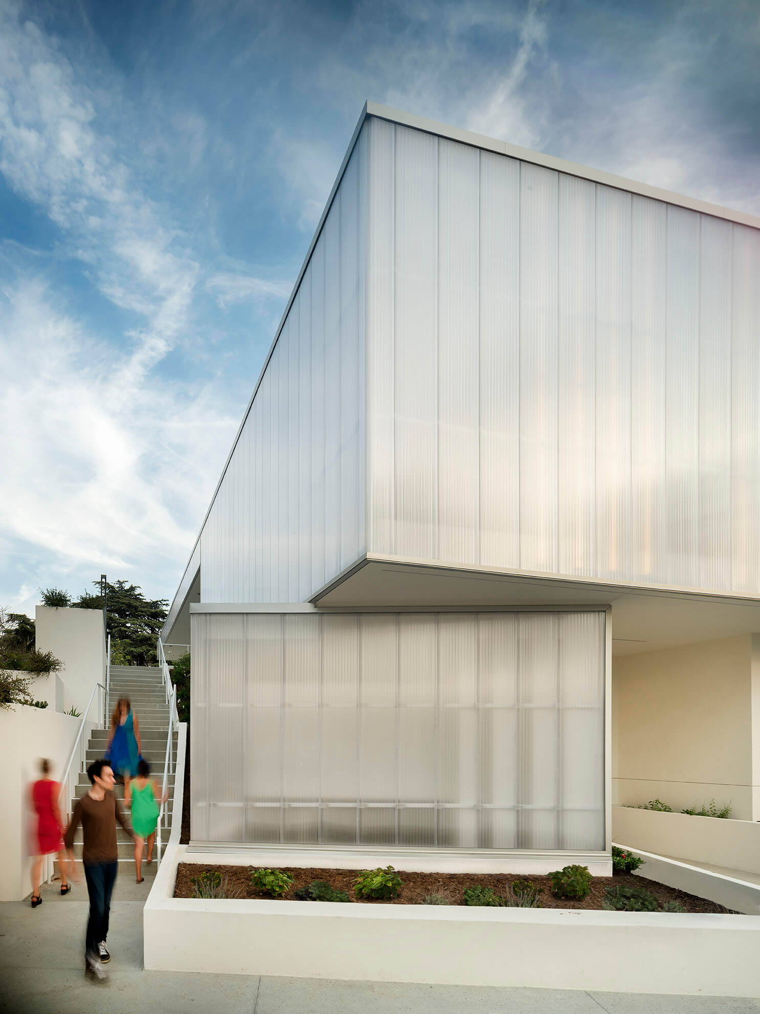 exterior view of a performing arts building wrapped in a polycarbonate facade