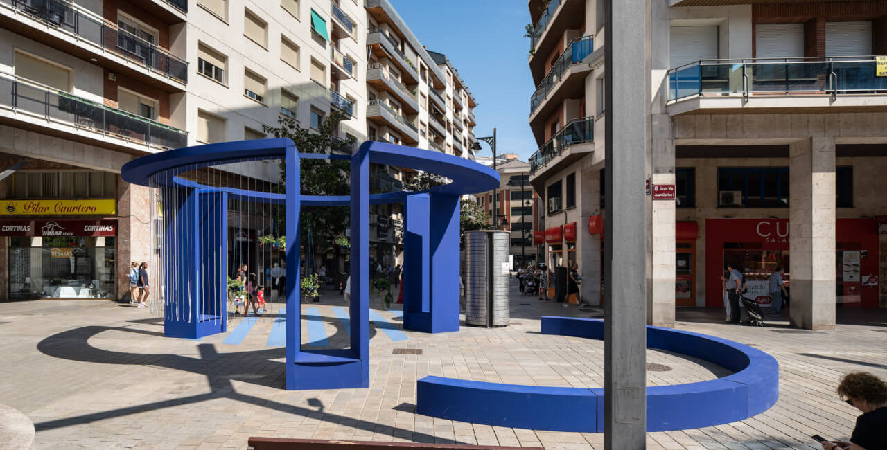 a large blue installation in the heart of a spanish city