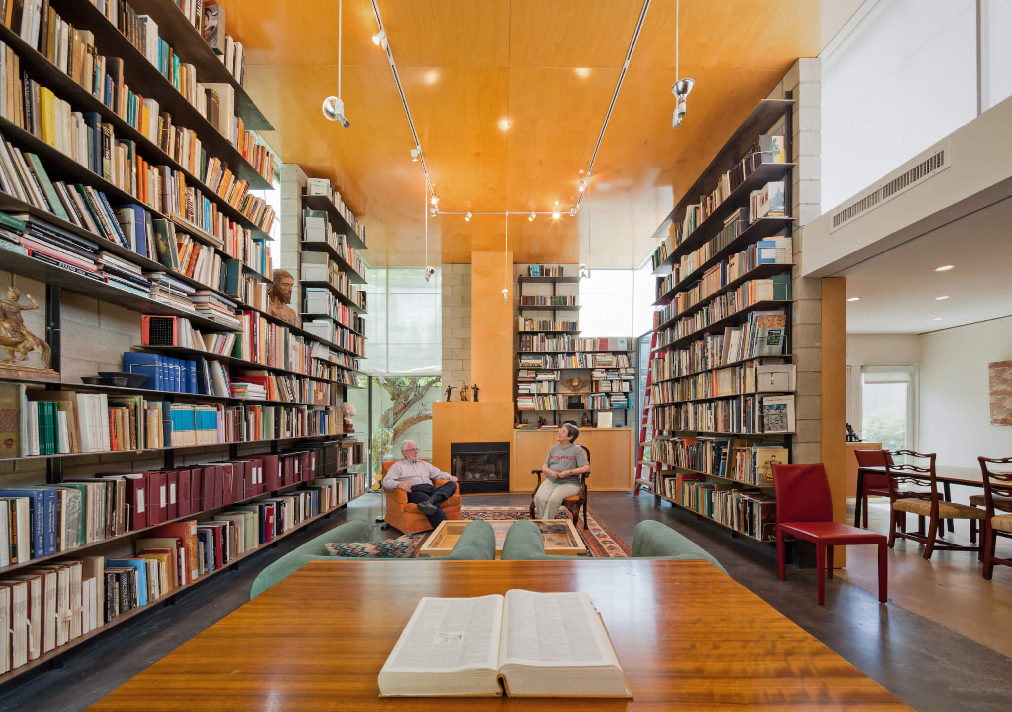 a large modern home interior lined with books