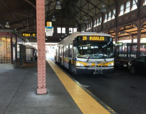 a 28 bus in boston departing a station