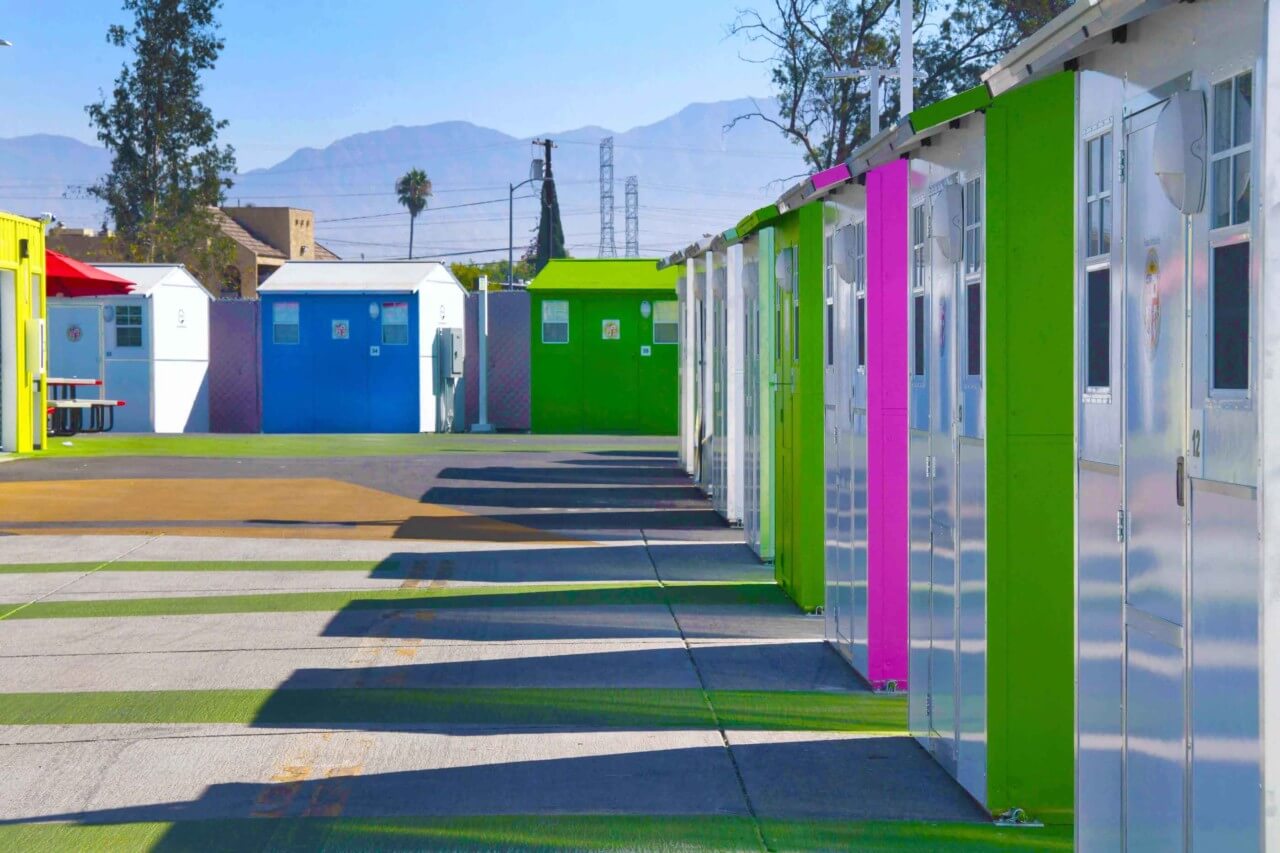 a row of brightly colored micro-homes