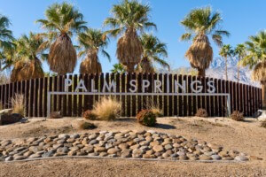 A sign reading palm springs, for modernism week