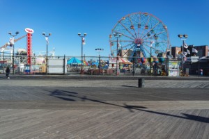The coney island boardwalk with wonder wheel behind it