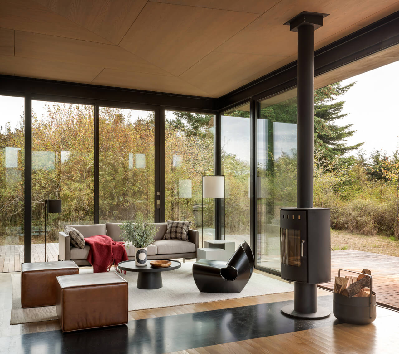 Inside of a modern cabin with a fireplace