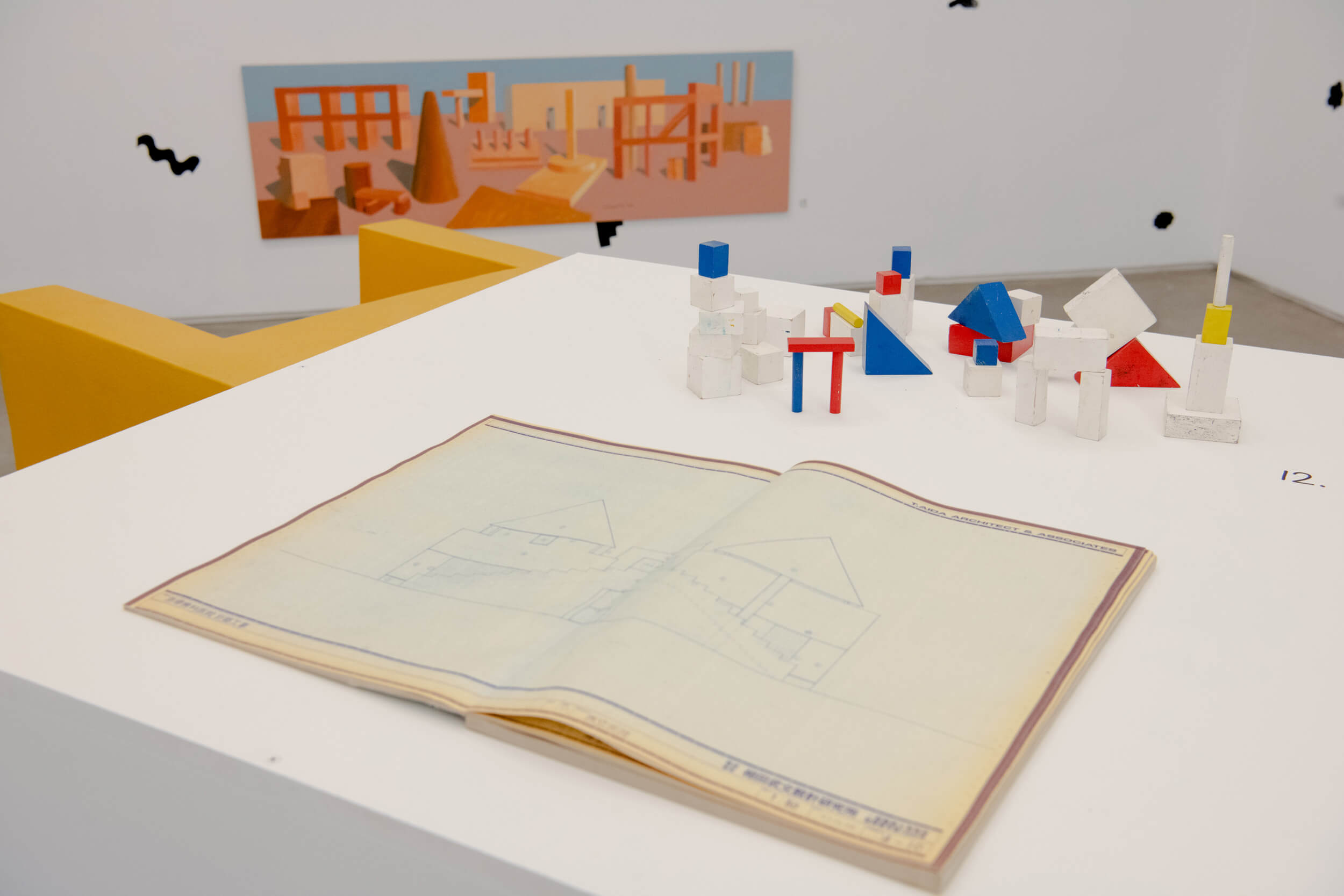 photograph of the interiors of an art gallery depicting playing blocks and painting