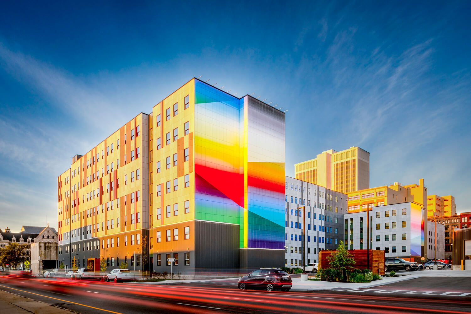the side of a residential building with a large colorful mural